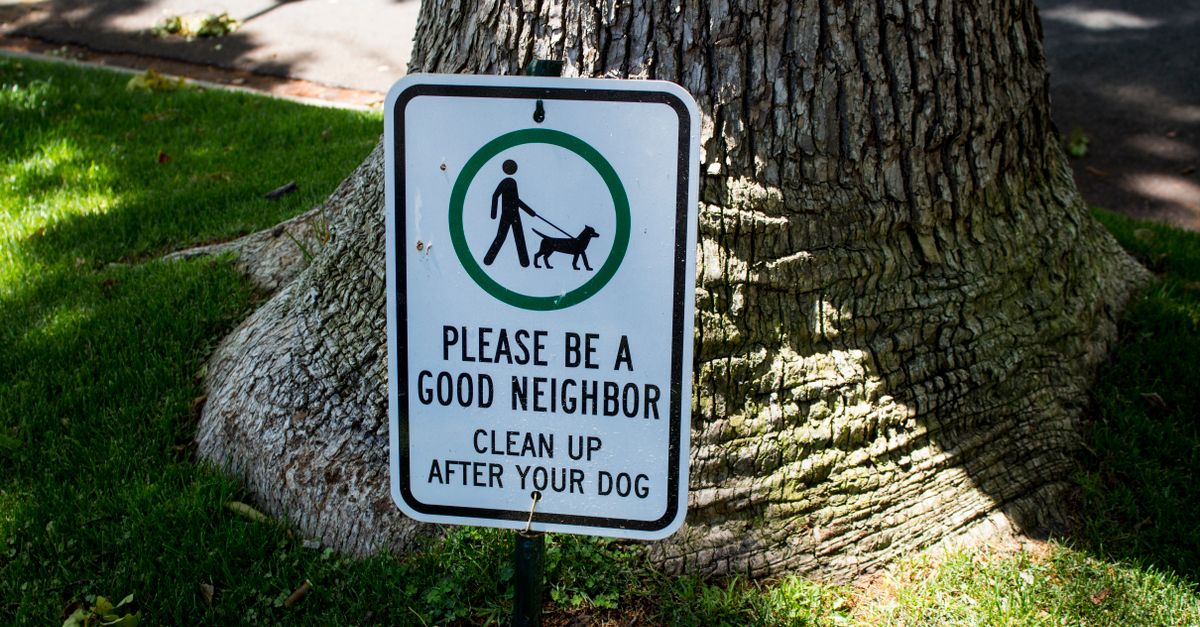 Sign in Beverly Hills park urging dog owners to clean up after their pets.